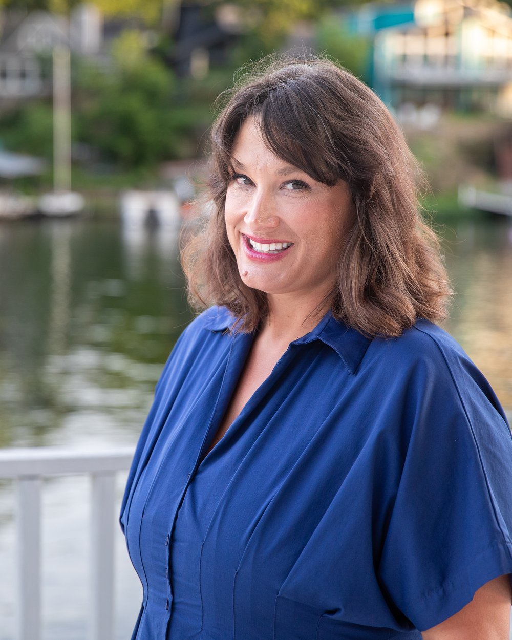 Laurie Runkle standing on a dock at Lake Lotawana
