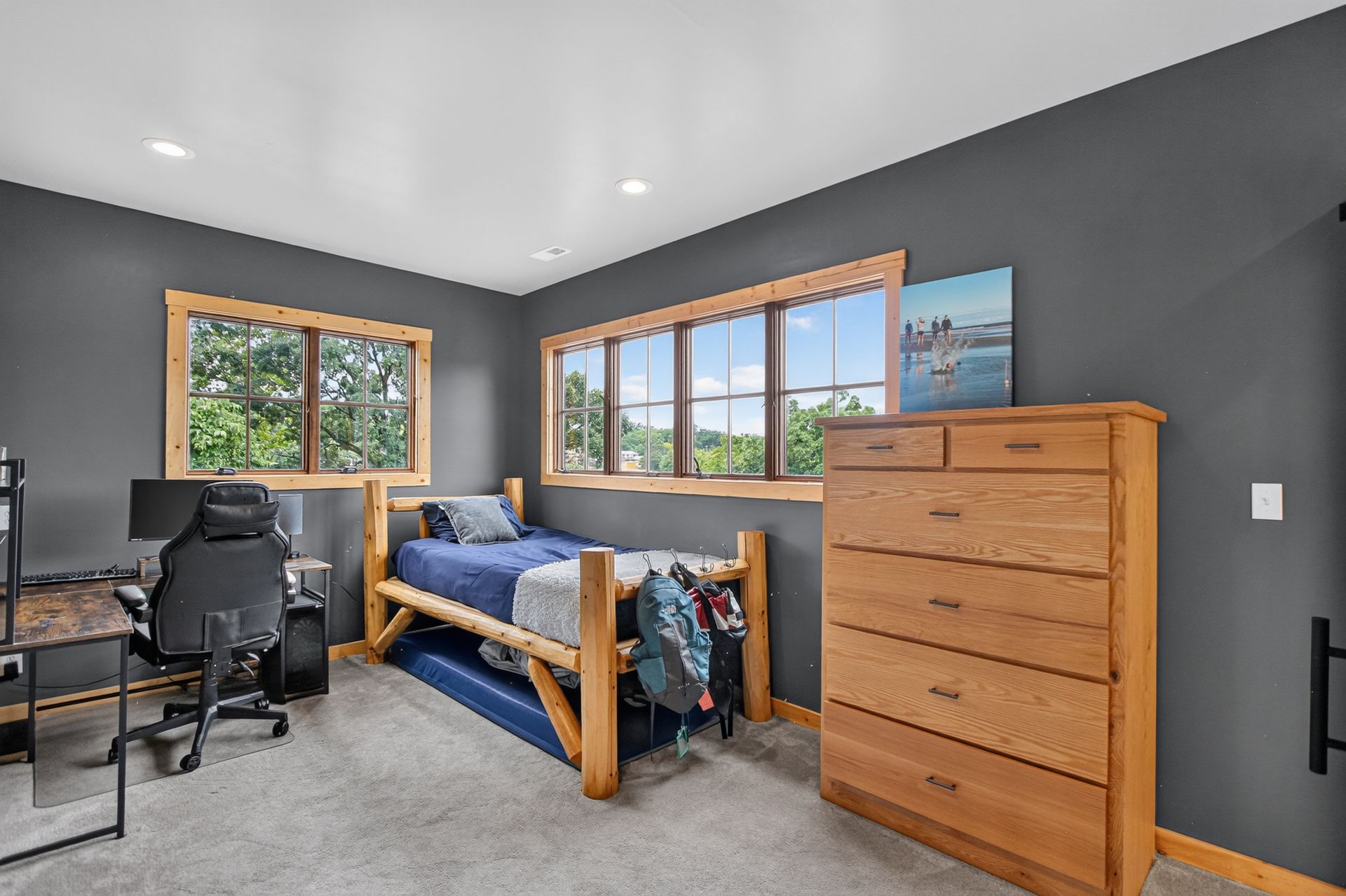 Bedroom with log-frame twin bed and trundle at 31 H Street, Lake Lotawana