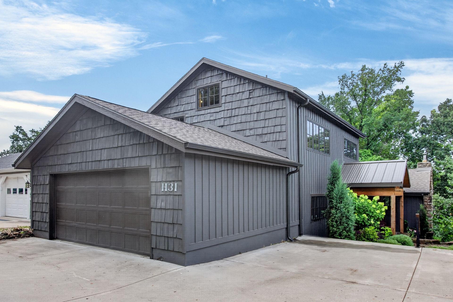 Daytime front exterior of 31 H Street with the H31 house number, Lake Lotawana