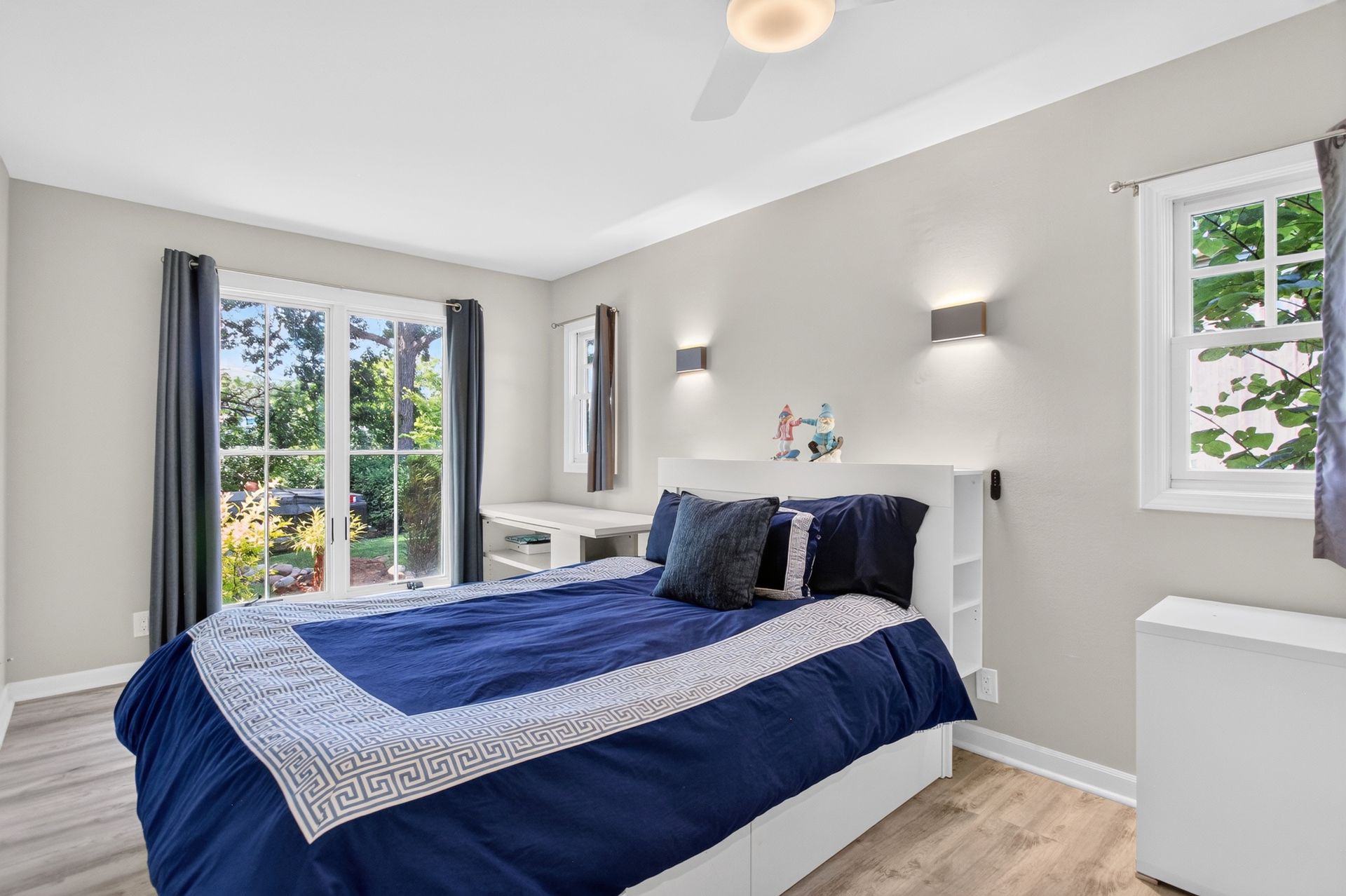 Guest bedroom with navy bedding at 31 H Street, Lake Lotawana