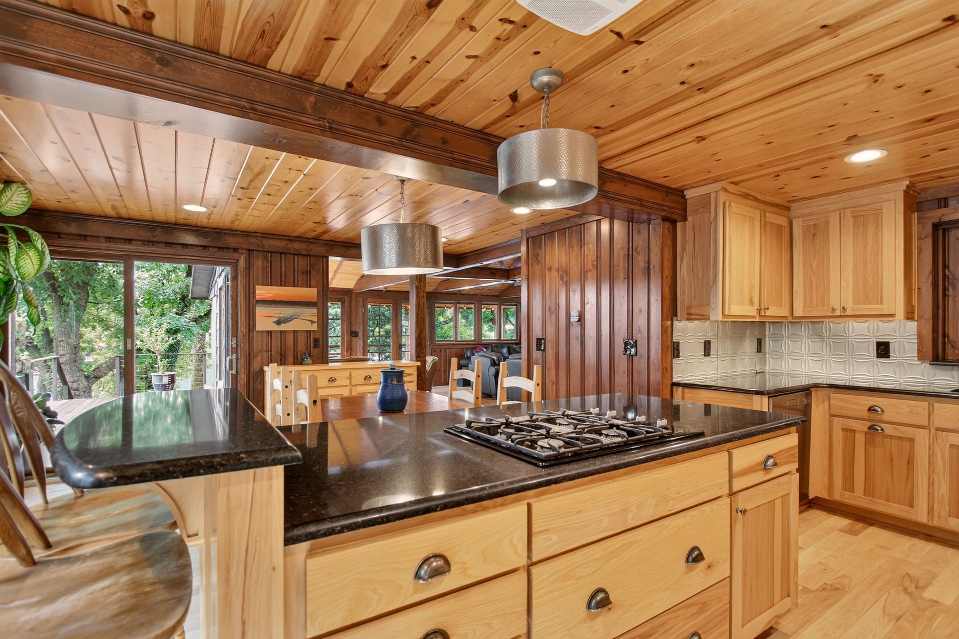 Wide view of the kitchen island and dining area at 31 H Street, Lake Lotawana