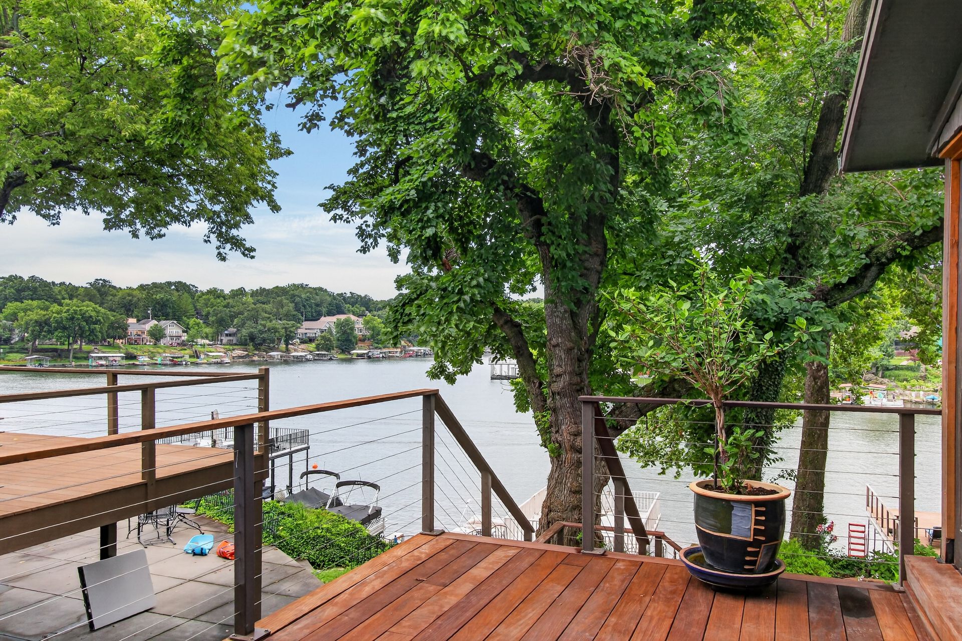 Lake view through mature trees from the deck at 31 H Street, Lake Lotawana
