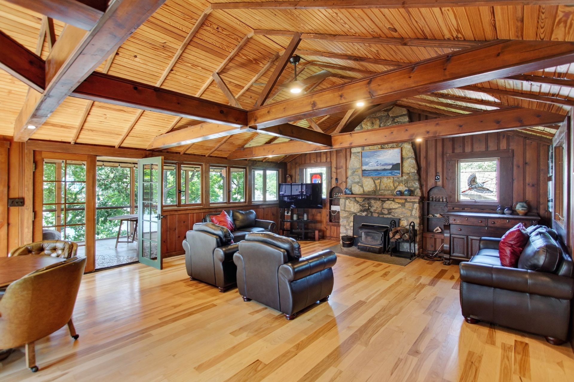 Living room seating area with stone fireplace at 31 H Street, Lake Lotawana