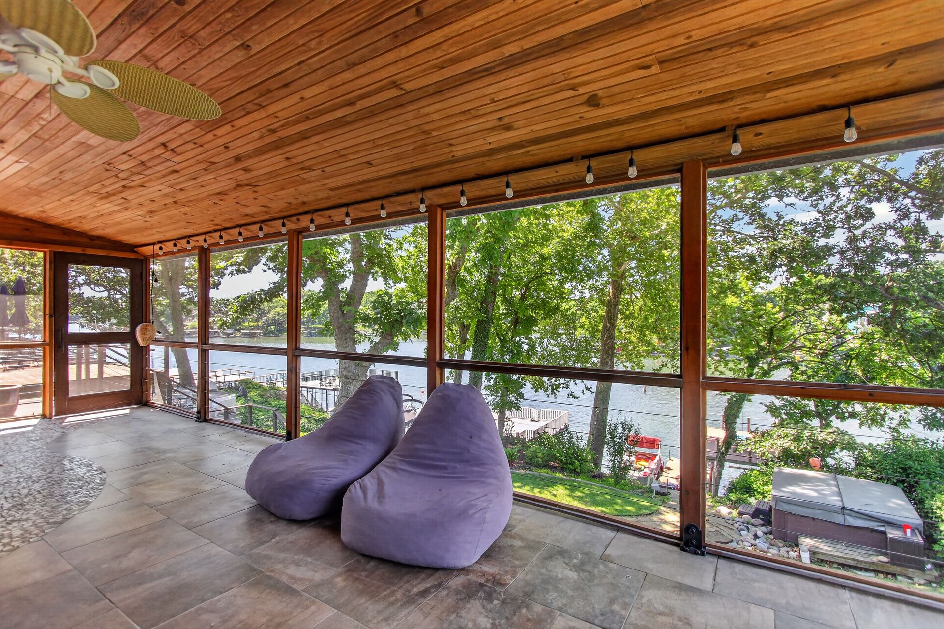 Screened porch with lake view and seating at 31 H Street, Lake Lotawana