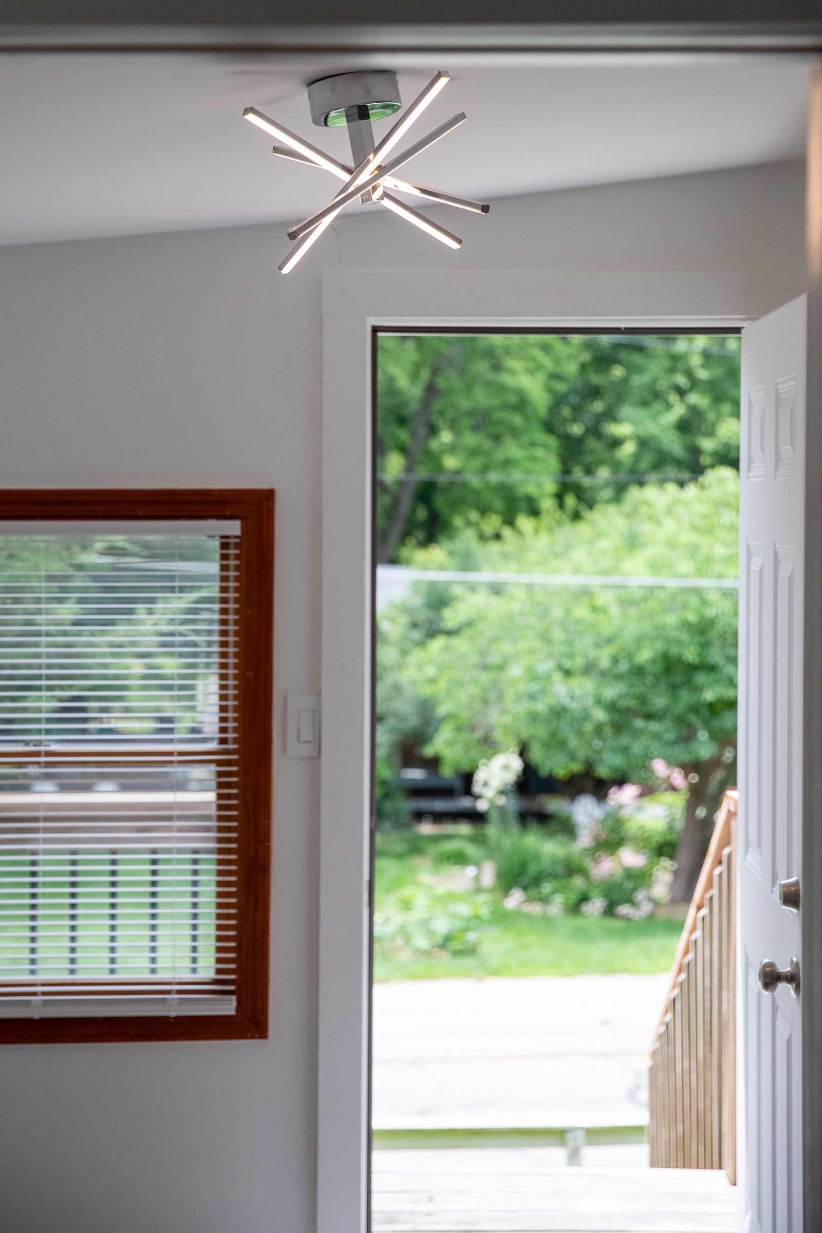 Entry hallway with door open to the backyard at 61 H Street, Lake Lotawana
