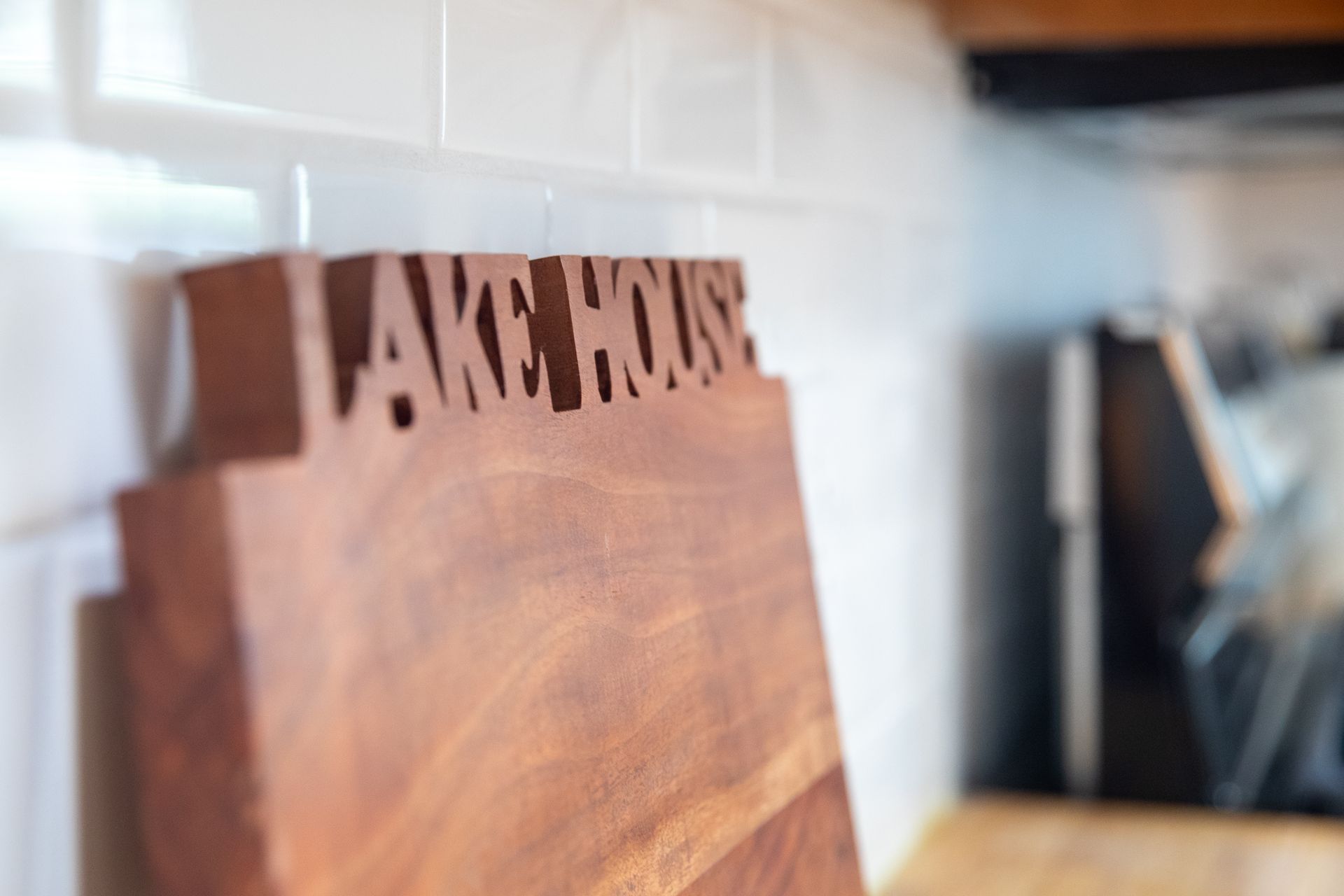Lake House wood sign detail in the kitchen at 61 H Street, Lake Lotawana